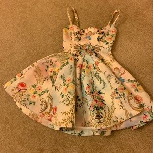 Mini party dress with angels and floral design